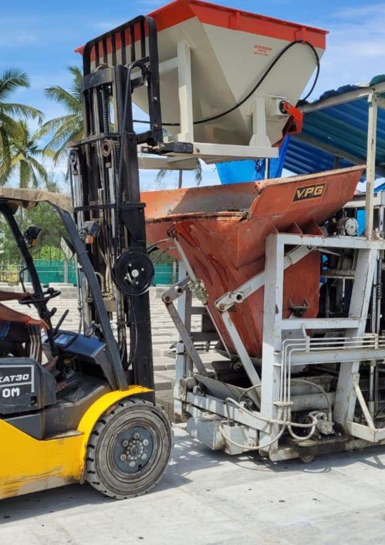 Forklift carrying a bin unit