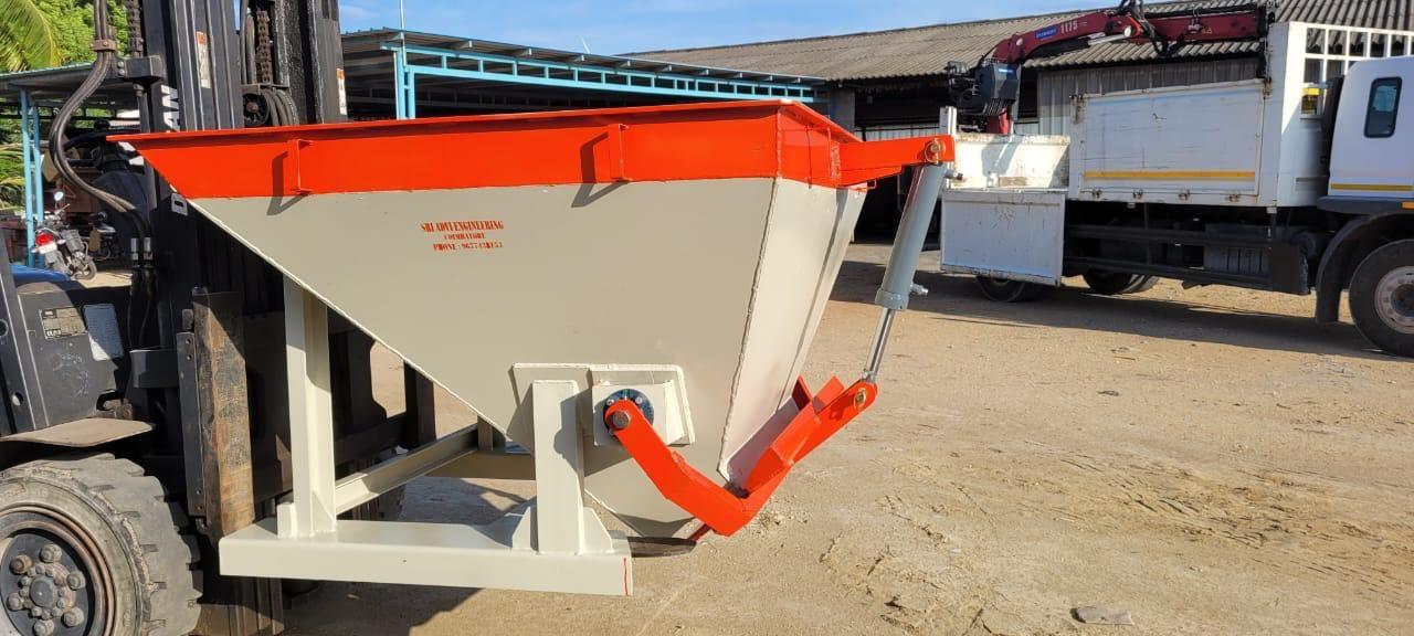Orange forklift bin unit with discharge gate beside a truck